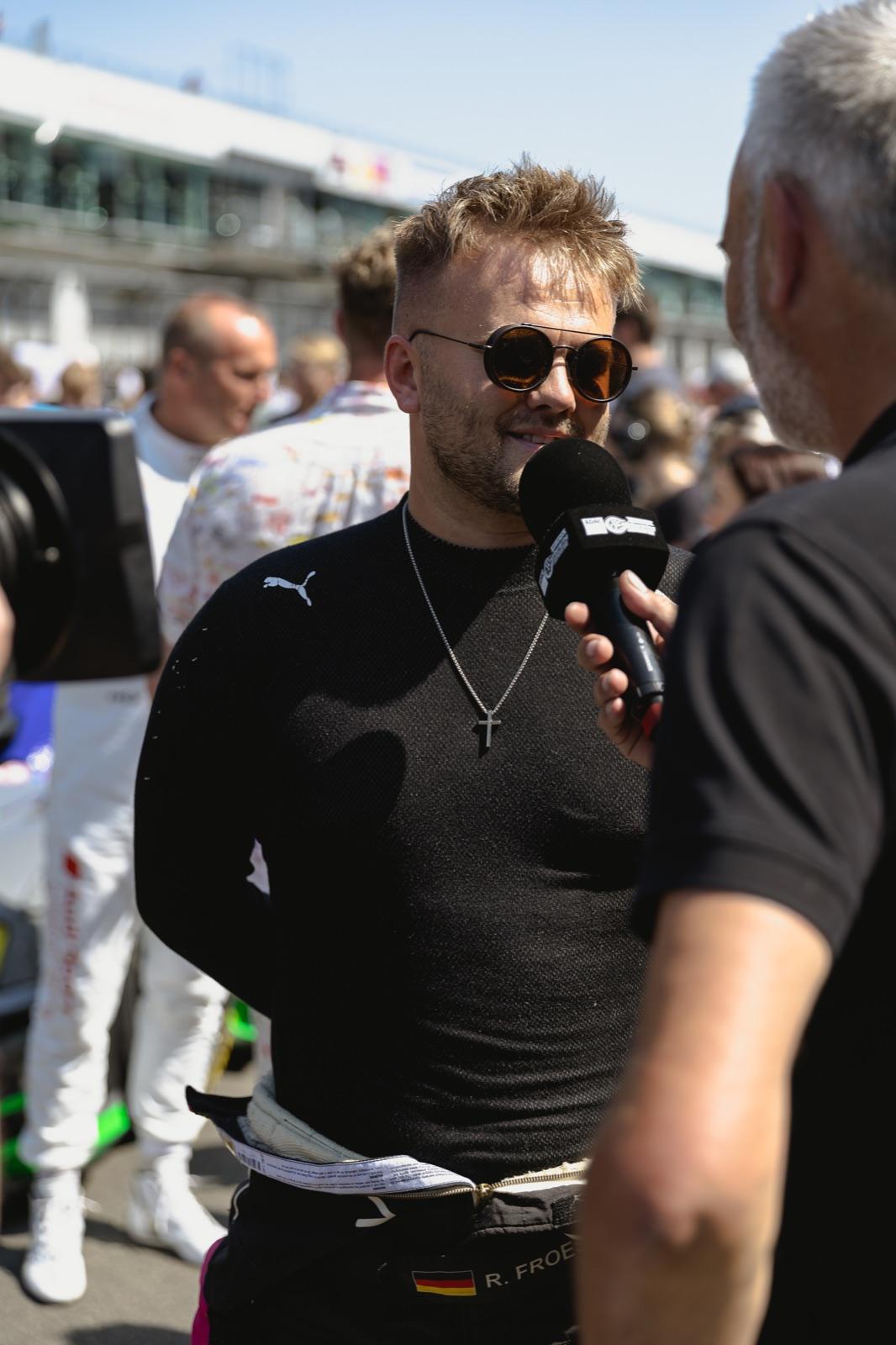 Roland Froese giving an interview on the starting grid